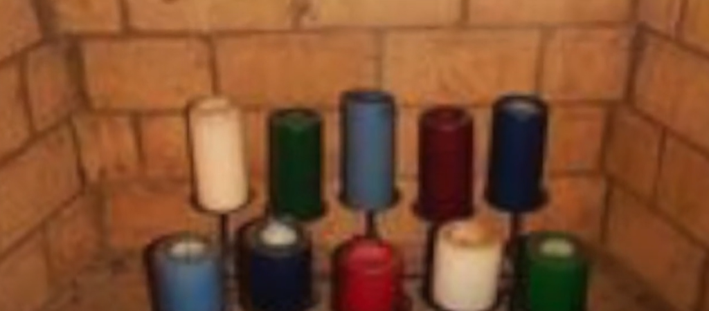 Pillar Candles in Front of a Mirror